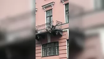 Toxic Couple Quarrels From Third Floor Balcony Onto Sidewalk