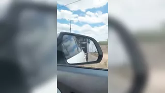 A Truck Drove Off The Highway With A Car In It