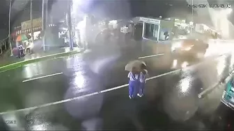 Two Girls In Vietnam Share An Umbrella