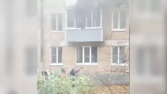 Woman Jumps From Burning Building