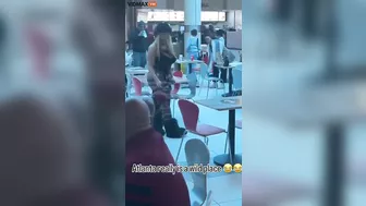 A Woman Walks Her Dog At An Atlanta Mall