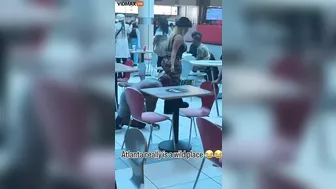 A Woman Walks Her Dog At An Atlanta Mall