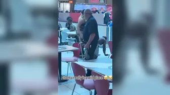 A Woman Walks Her Dog At An Atlanta Mall
