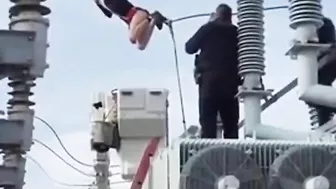 Woman Climbs On Transformer At Substation