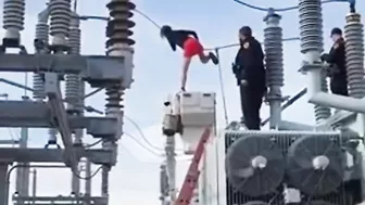 Woman Climbs On Transformer At Substation