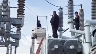 Woman Climbs On Transformer At Substation