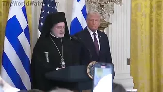 Audience Cheers As Archbishop Trump Presents Holy Cross