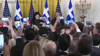 Audience Cheers As Archbishop Trump Presents Holy Cross