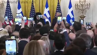 Audience Cheers As Archbishop Trump Presents Holy Cross