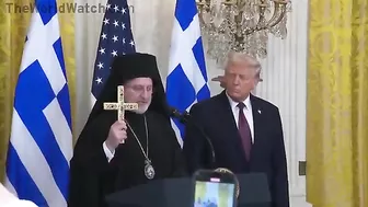 Audience Cheers As Archbishop Trump Presents Holy Cross