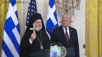 Audience Cheers As Archbishop Trump Presents Holy Cross