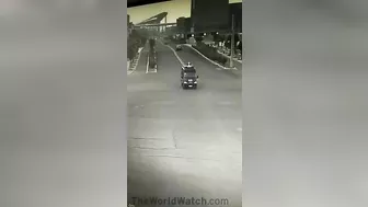 Paramedics In An Ambulance Are Seen Dumped Out On The Street With Lights Flashing After The Accident