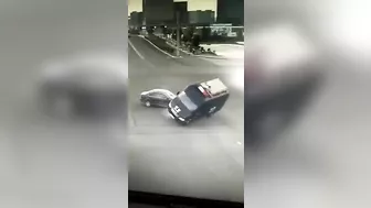 Paramedics In An Ambulance Are Seen Dumped Out On The Street With Lights Flashing After The Accident