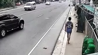 A Man Walking Casually Along The Sidewalk Becomes Part Of The Sidewalk