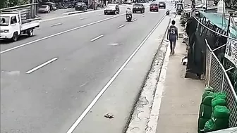 A Man Walking Casually Along The Sidewalk Becomes Part Of The Sidewalk