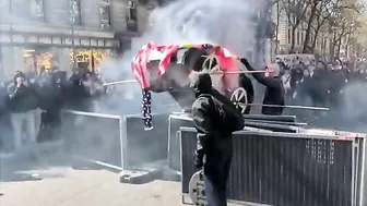 Protesters In Paris Display American Flags And Cardboard Teslas