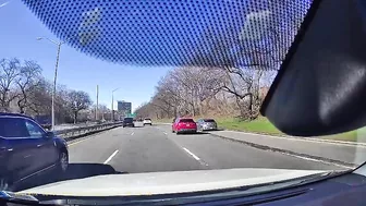 Slow Cyclist Causes Red Car To Merge Prematurely