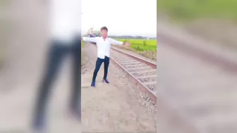 Posing Next To A Moving Train