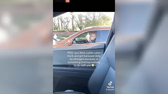Total Loser Gives The Middle Finger To A Woman Driving A Pink Cybertruck