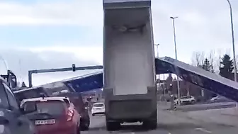 Truck Hits Huge Road Sign