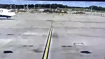 Vehicles Driving In Front Of An Aircraft
