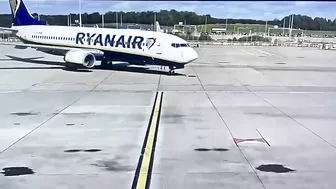 Vehicles Driving In Front Of An Aircraft