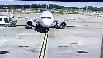 Vehicles Driving In Front Of An Aircraft