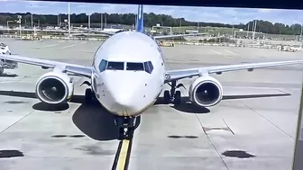 Vehicles Driving In Front Of An Aircraft
