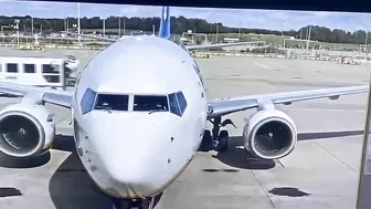 Vehicles Driving In Front Of An Aircraft